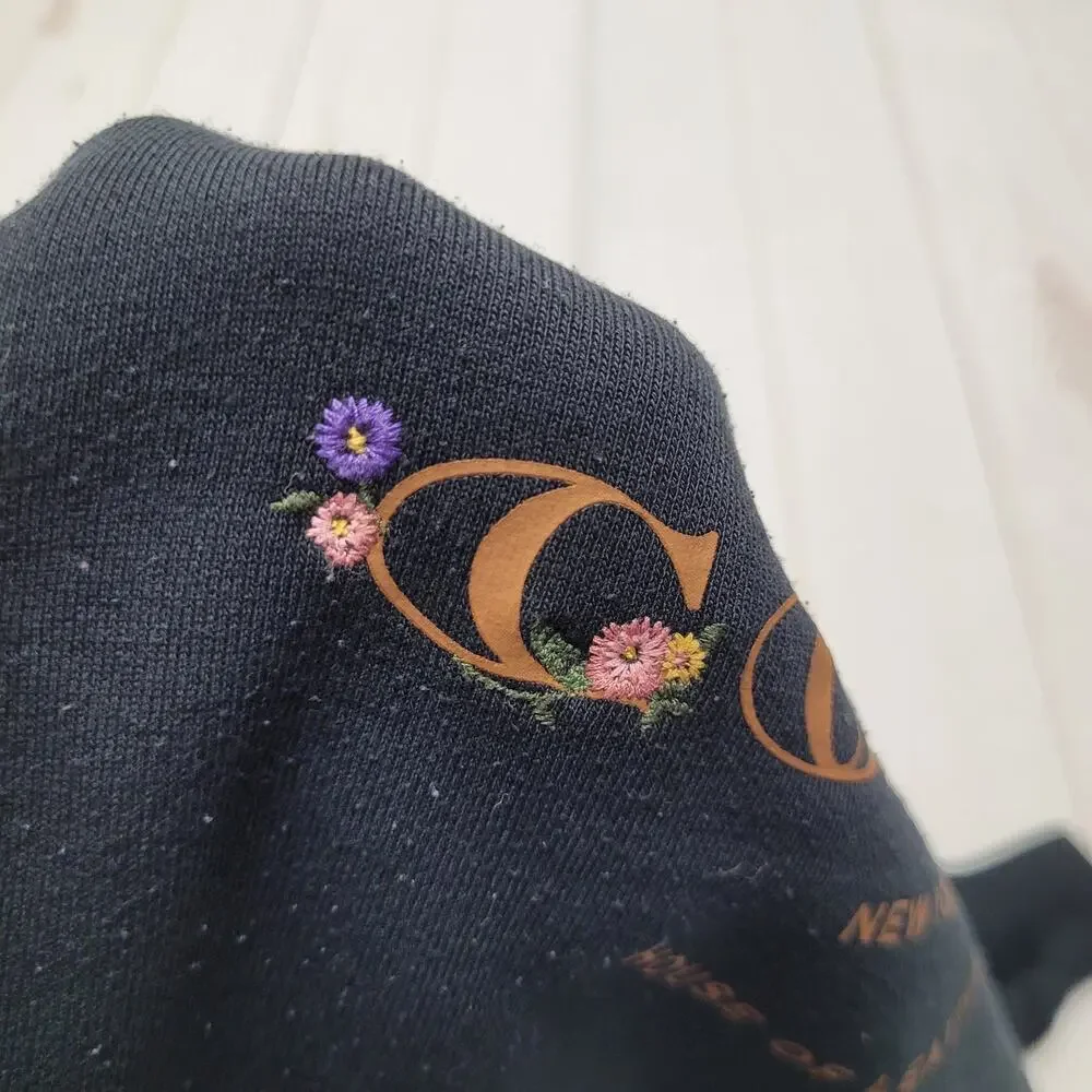 Coach black crew neck floral embroidered fleece pullover large logo